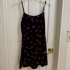 Black strap dress with cherries. Non-stretch material.